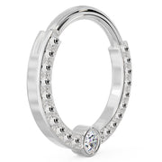 Angled view of larger 14k white gold dome bead clicker ring highlighting polished bead detail