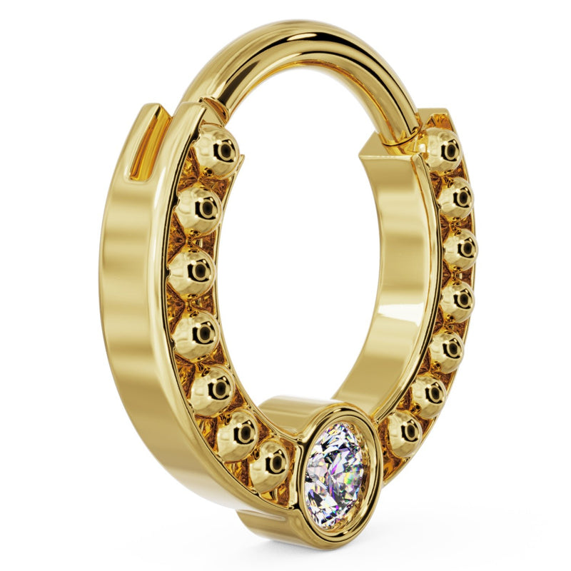 Side profile of 14k yellow gold dome bead clicker ring showing depth of beaded texture and hinge