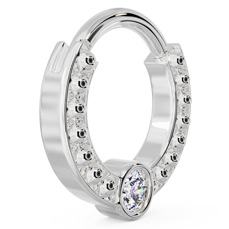 Side profile of 14k white gold dome bead clicker ring showing smaller hoop size and bezel diamond