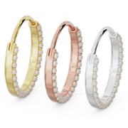 Three large pearl clicker hoops in 14k yellow, rose, and white gold, angled side view comparison