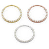 Large pearl clicker ring hoops in yellow, rose, and white gold shown from above in size comparison