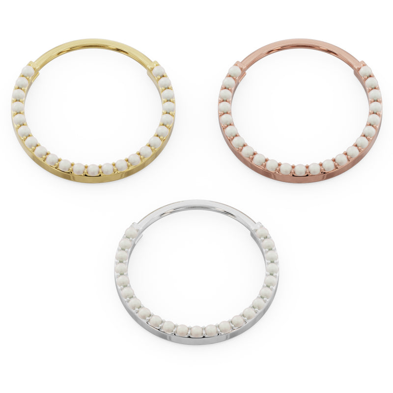 Large pearl clicker ring hoops in yellow, rose, and white gold shown from above in size comparison