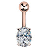 14k rose gold navel ring with oval CZ stone in four-prong setting, front view