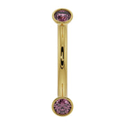 14K yellow gold curved barbell with dual bezel-set pink sapphires, front view