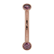 14K rose gold pink sapphire bezel-set curved barbell, front view showing warm blush tone