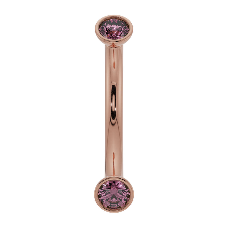14K rose gold pink sapphire bezel-set curved barbell, front view showing warm blush tone