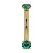 14K yellow gold dainty emerald curved barbell with dual prong-set round emeralds, front view