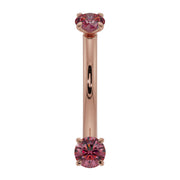 14k rose gold ruby prong-set curved barbell with dual red rubies, front view