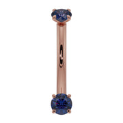 14K rose gold blue sapphire prong-set curved barbell, front view with warm pink gold shaft