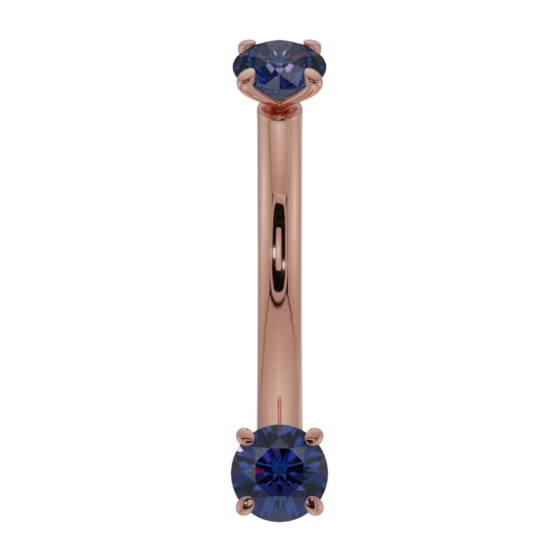 14K rose gold blue sapphire prong-set curved barbell, front view with warm pink gold shaft