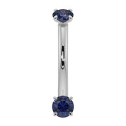 14K white gold blue sapphire curved barbell, front view highlighting cool-toned metal contrast