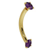 14K yellow gold amethyst curved barbell with dual prong-set purple stones, angled side view