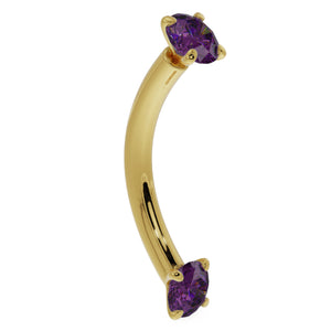14K yellow gold amethyst curved barbell with dual prong-set purple stones, angled side view