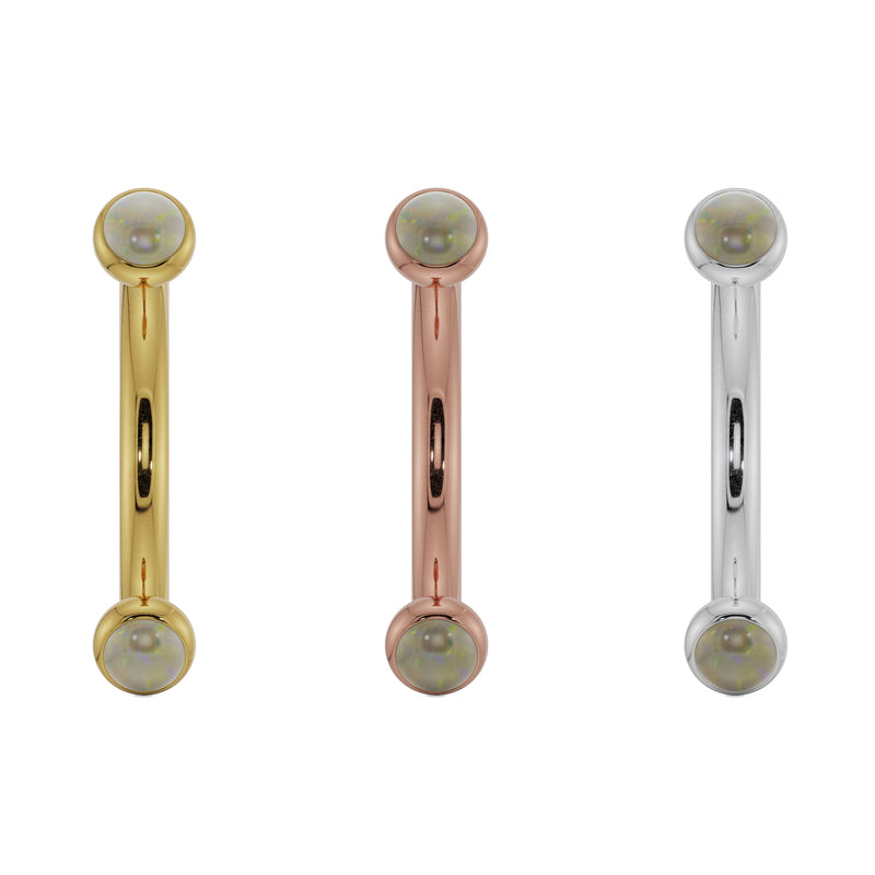 Opal bezel curved barbell shown in all three 14k gold options: yellow, rose, and white gold