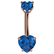14k rose gold navel ring with dual sapphire blue CZ heart stones in prong settings, front view