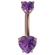 14k rose gold belly ring with dual purple CZ heart stones in prong settings, front view