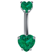 14k white gold navel ring with dual dark green CZ heart stones in prong settings, front view