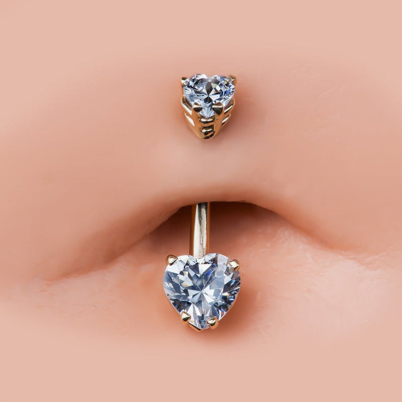 14k rose gold heart CZ belly ring shown in navel piercing, close-up fit view