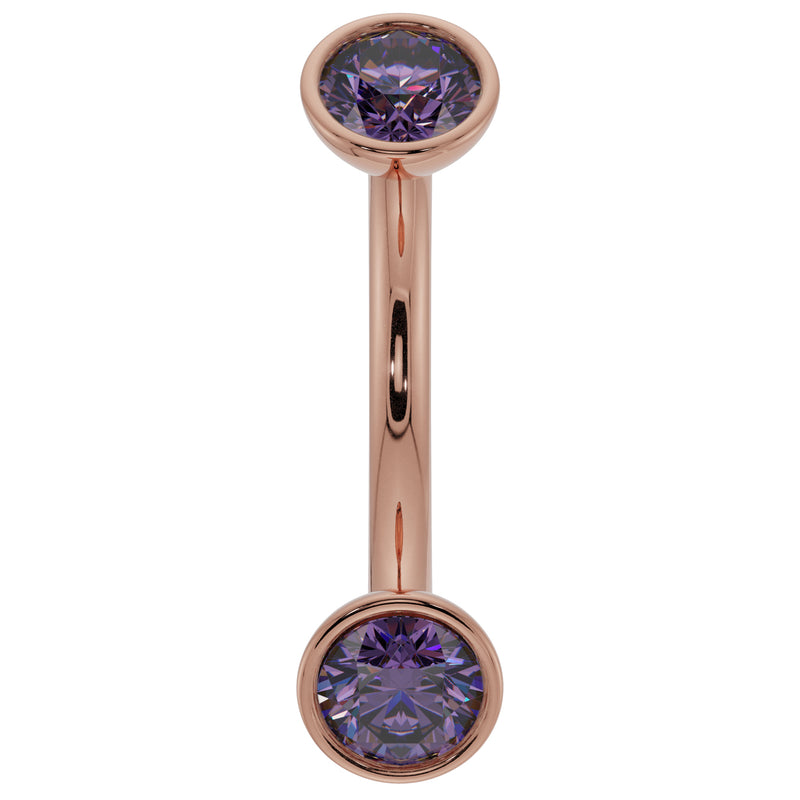 14k rose gold amethyst bezel curved barbell with larger round purple stones, angled view