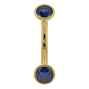 14k yellow gold blue sapphire bezel-set curved barbell, front view showing dual round gemstones