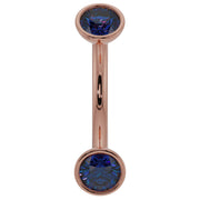 14k rose gold blue sapphire bezel-set curved barbell with dual round sapphires, front view