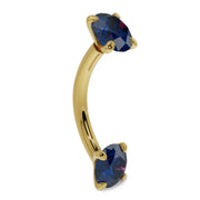 14k yellow gold blue sapphire curved barbell, side profile showing dual prong-set stones and curved shaft