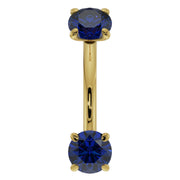 14k yellow gold blue sapphire prong-set curved barbell, front view with two round sapphires
