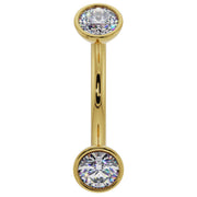 14k yellow gold 14G diamond bezel curved barbell with larger 3mm diamonds, front view