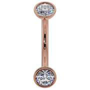 14k rose gold diamond bezel-set curved barbell with two round diamonds, front view