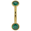 14k yellow gold curved barbell with dual bezel-set emeralds, front view on white background