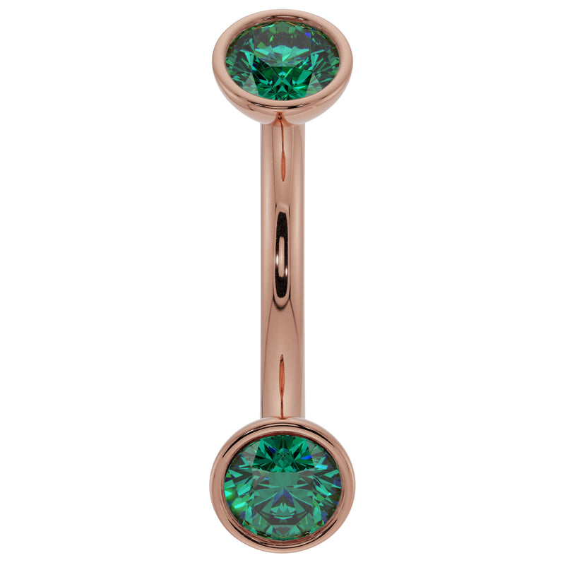 14k rose gold curved barbell with dual bezel-set emeralds, front view showing warm pink tone