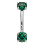 Close-up front view of 14K white gold emerald curved barbell highlighting larger 14G stone size