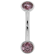 14K white gold pink sapphire bezel-set curved barbell with larger stones, front view
