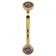 Angled view of 14K yellow gold pink sapphire curved barbell with top end cap detached