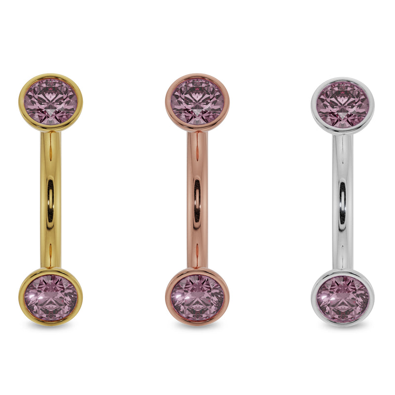 All three metal options of pink sapphire bezel curved barbell in yellow, rose, and white gold