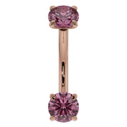 14k rose gold pink sapphire curved barbell front view with larger-gauge prong-set sapphires