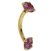 14k yellow gold pink sapphire curved barbell, angled side view showing curved bar and prong-set gems