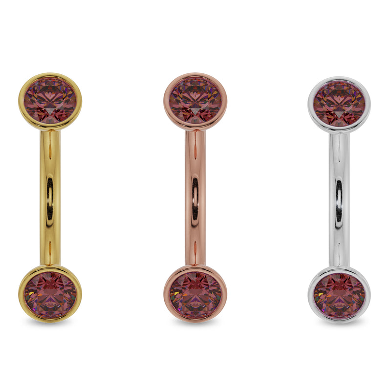 Ruby bezel curved barbell in all three metal options: 14k yellow gold, rose gold, and white gold