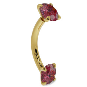 14k yellow gold ruby curved barbell, angled side view showing dual prong-set red gemstones