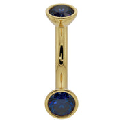 14k yellow gold 14G curved barbell with larger 4mm bezel-set blue sapphires for belly ring use