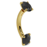 14k yellow gold black diamond curved barbell angled view highlighting the banana curve and faceted stones