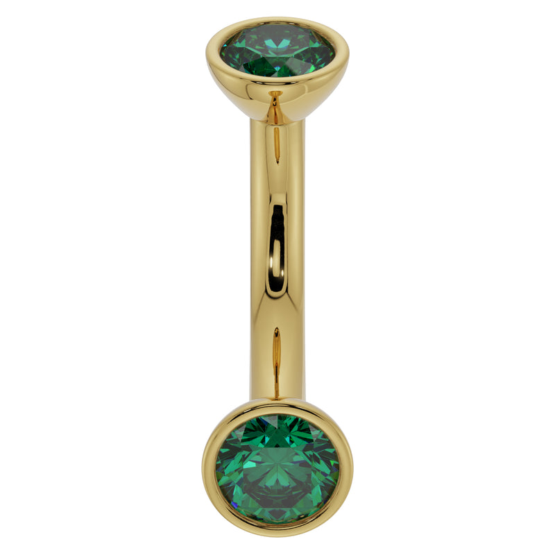 14k yellow gold 14G belly ring with dual bezel-set emeralds, angled front view showing domed top ball