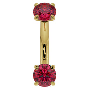 14k yellow gold 14G ruby belly ring with larger prong-set rubies, front view