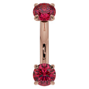 14k rose gold 14G ruby belly ring with dual prong-set rubies on curved barbell, front view