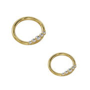 Two 14K yellow gold CZ seam ring hoops side by side showing large and small diameter size options