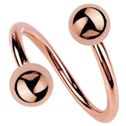 14k rose gold twister spiral barbell with warm-toned polished ball ends, front view