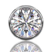 Extreme close-up of round brilliant diamond in bezel setting showing VS1 clarity and facet detail