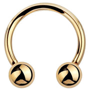 14k yellow gold circular barbell horseshoe ring with polished ball ends, front view