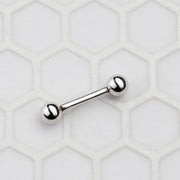 Small 14k white gold straight barbell on hexagon tile surface showing size reference for short length