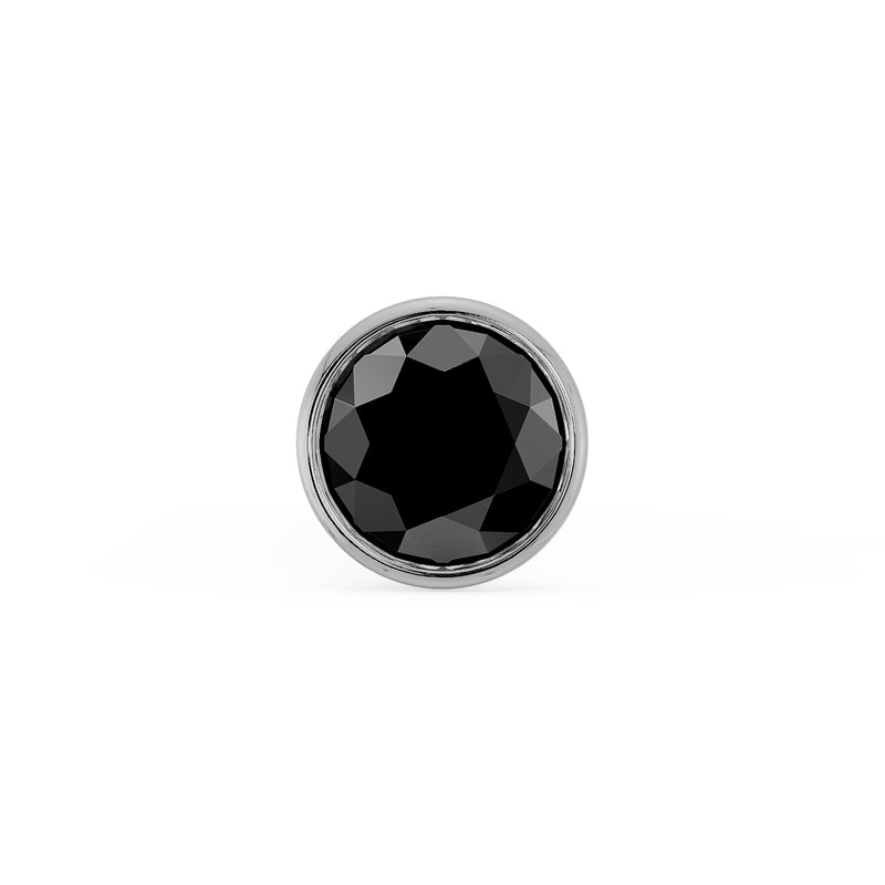 Close-up front view of 1.5mm black diamond in sleek white gold bezel setting